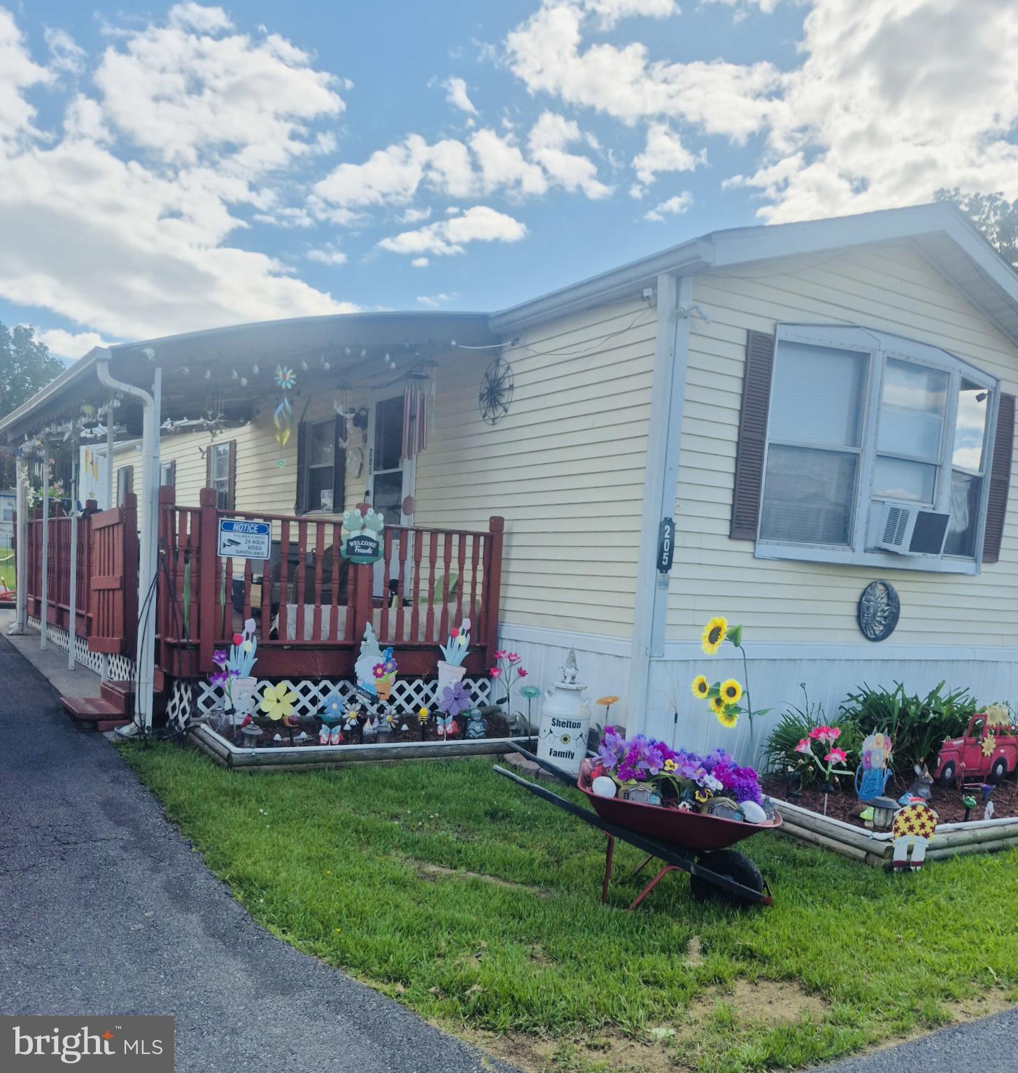 205 Robwood Road Dundalk, MD 21222 - Photo 2 of 14 Charming home with vibrant garden blooms.