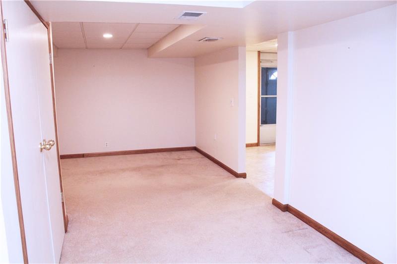3697 Mt Troy Road Pittsburgh, PA 15212 - Photo 14 of 25 Ready for you to set up your own game room space. This area could also be used as a third bedroom if need as there is an updated full bath in the basement, in addition to a large closet for storage.