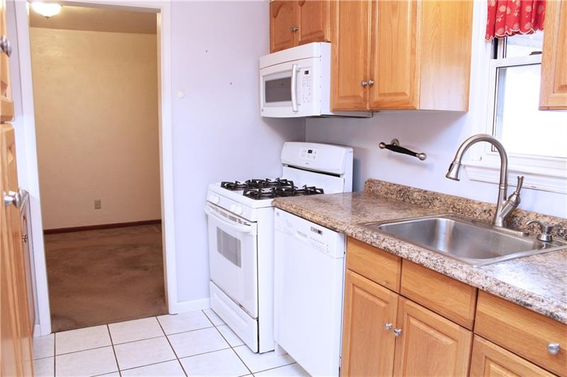 3697 Mt Troy Road Pittsburgh, PA 15212 - Photo 8 of 25 From the kitchen you can access the dining room.
