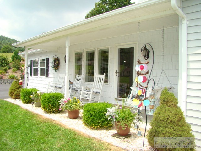 124 Alex Wellborn Road Deep Gap, NC 28618 - Photo 13 of 26 a front view of a house having yard
