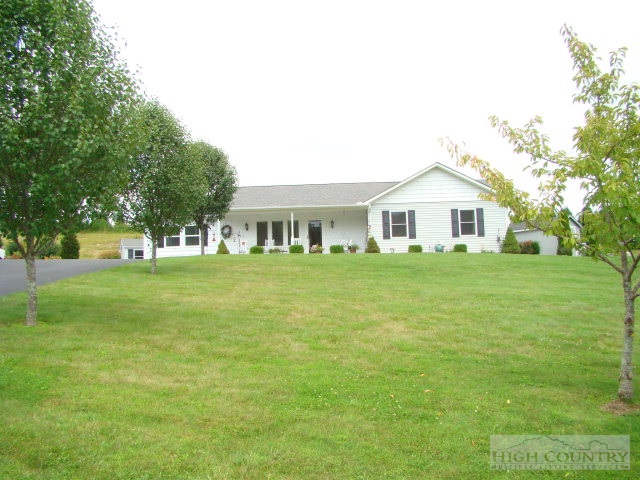 124 Alex Wellborn Road Deep Gap, NC 28618 - Photo 18 of 26 a front view of a house with a yard
