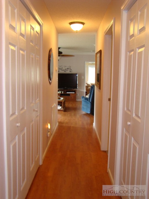 124 Alex Wellborn Road Deep Gap, NC 28618 - Photo 8 of 26 a view of a hallway with livingroom and furniture