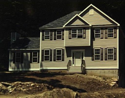a front view of a house with a small yard
