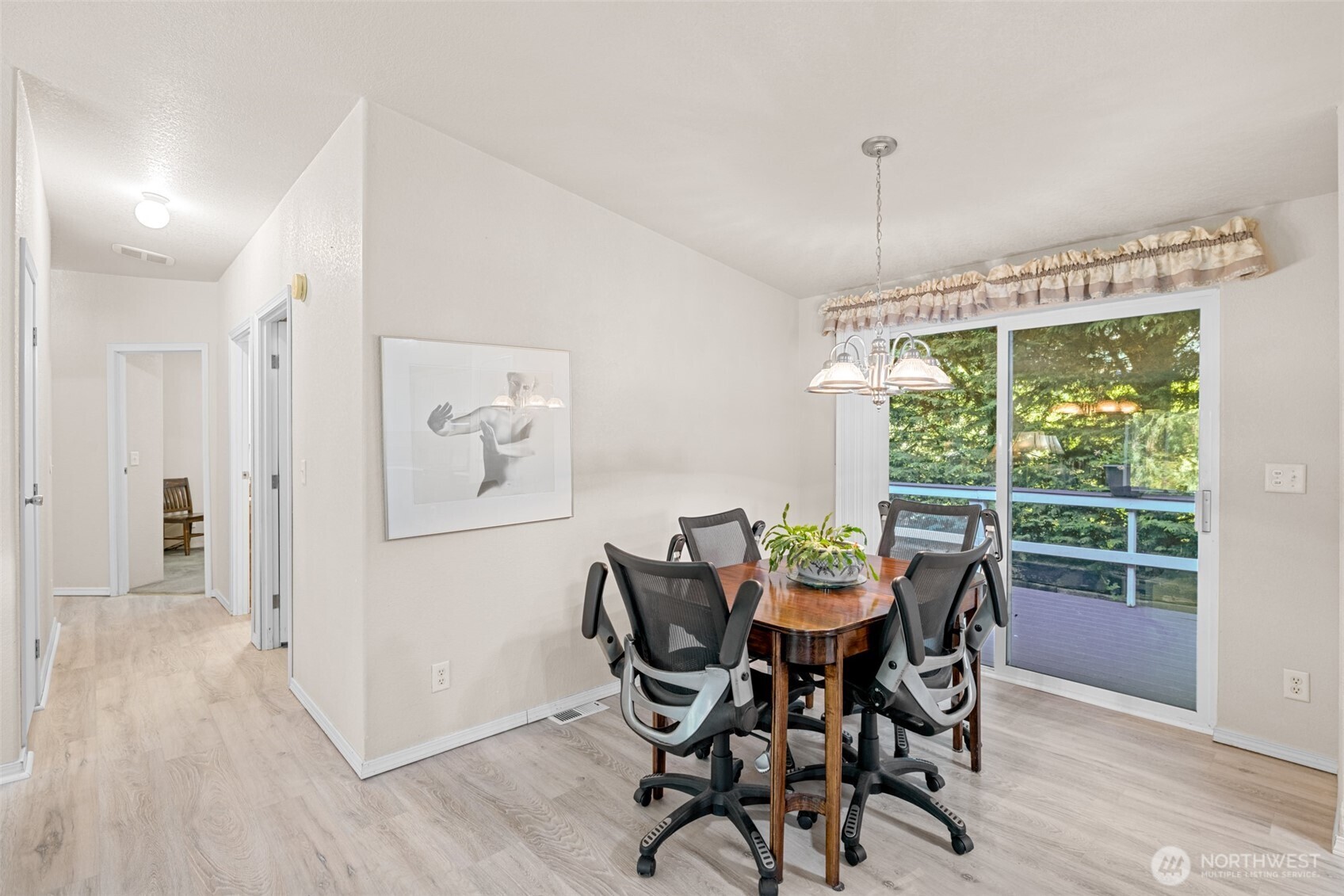 423 Fleming Drive Sequim, WA 98382 - Photo 14 of 33 a view of a dining room with furniture window and wooden floor