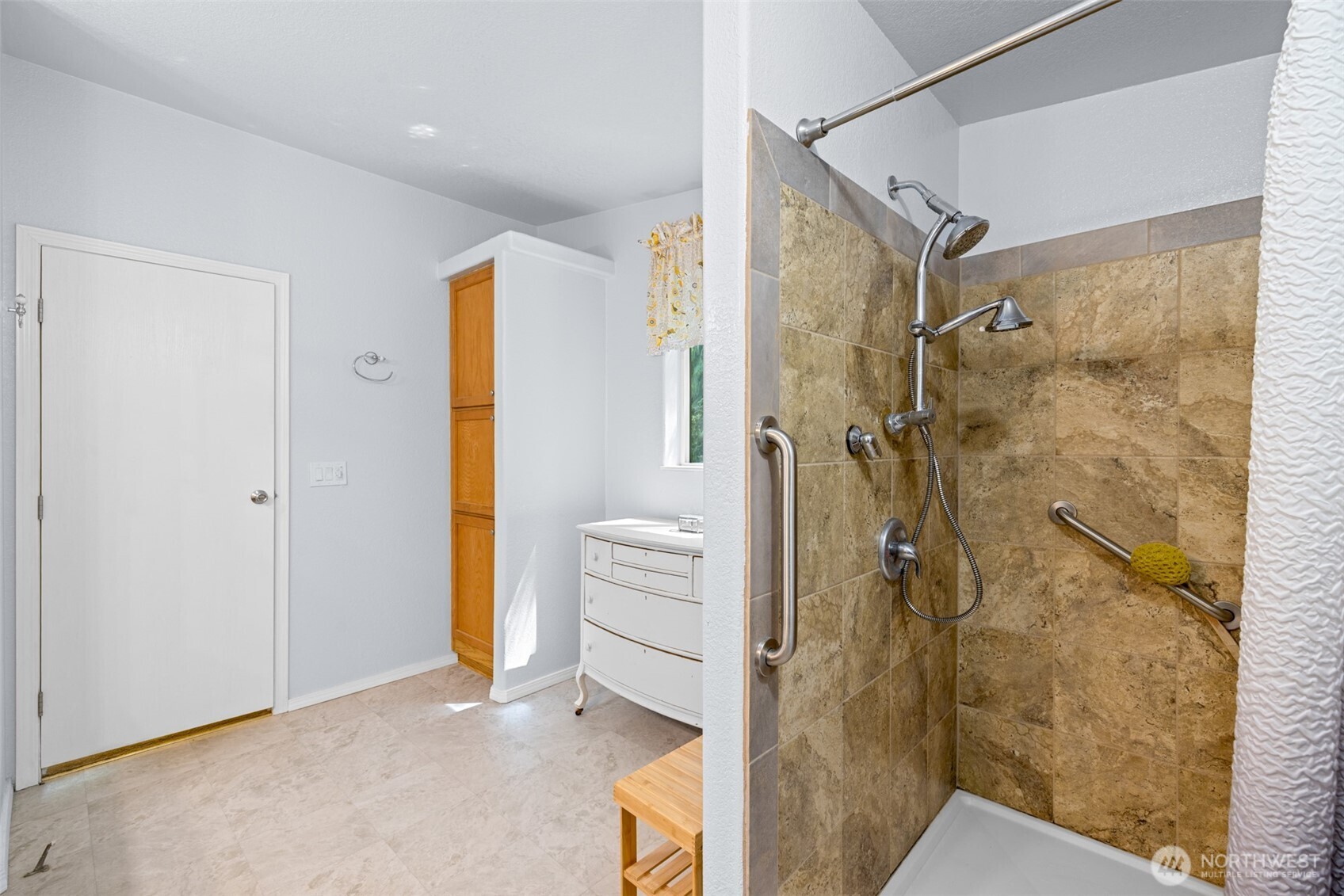 423 Fleming Drive Sequim, WA 98382 - Photo 16 of 33 a bathroom with a shower and a sink