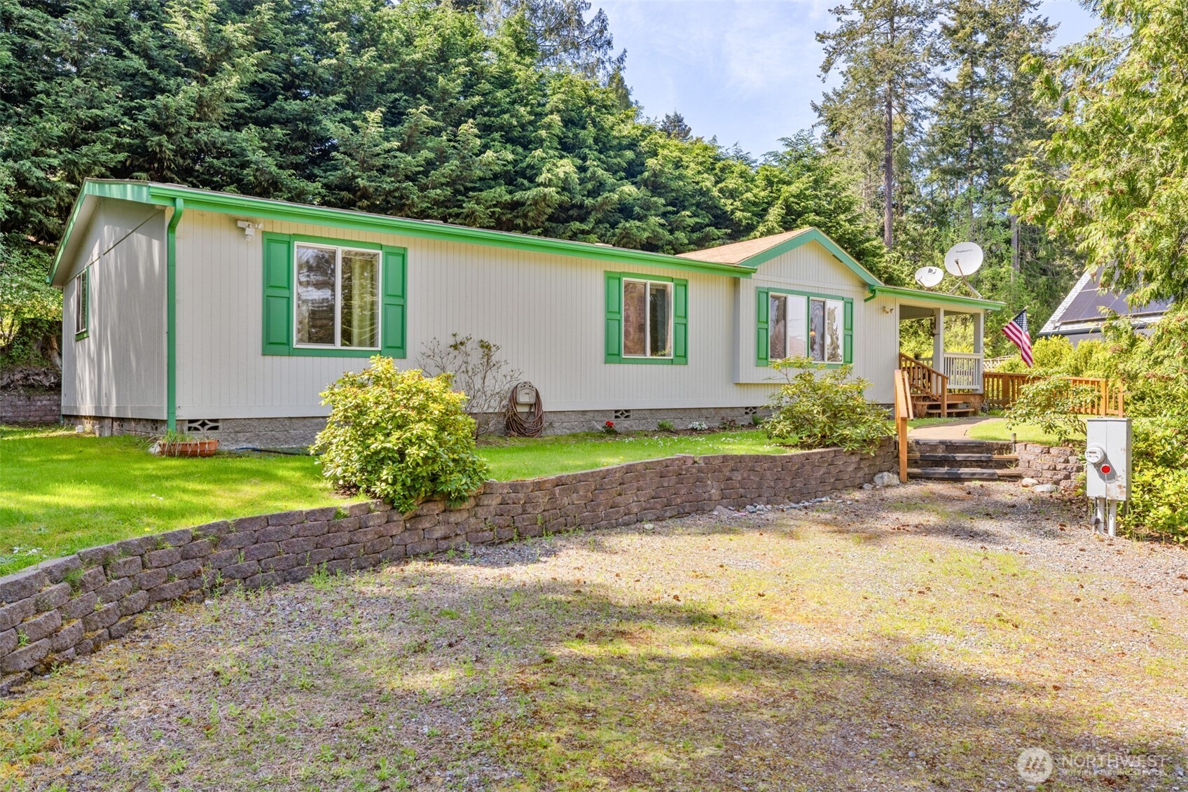 423 Fleming Drive Sequim, WA 98382 - Photo 18 of 33 a front view of a house with garden