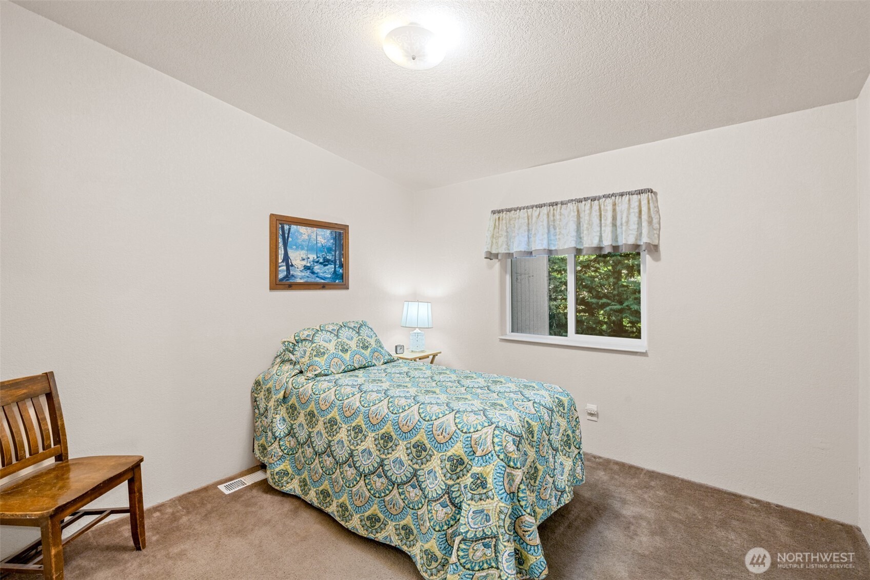 423 Fleming Drive Sequim, WA 98382 - Photo 20 of 33 a bedroom with a bed and a window