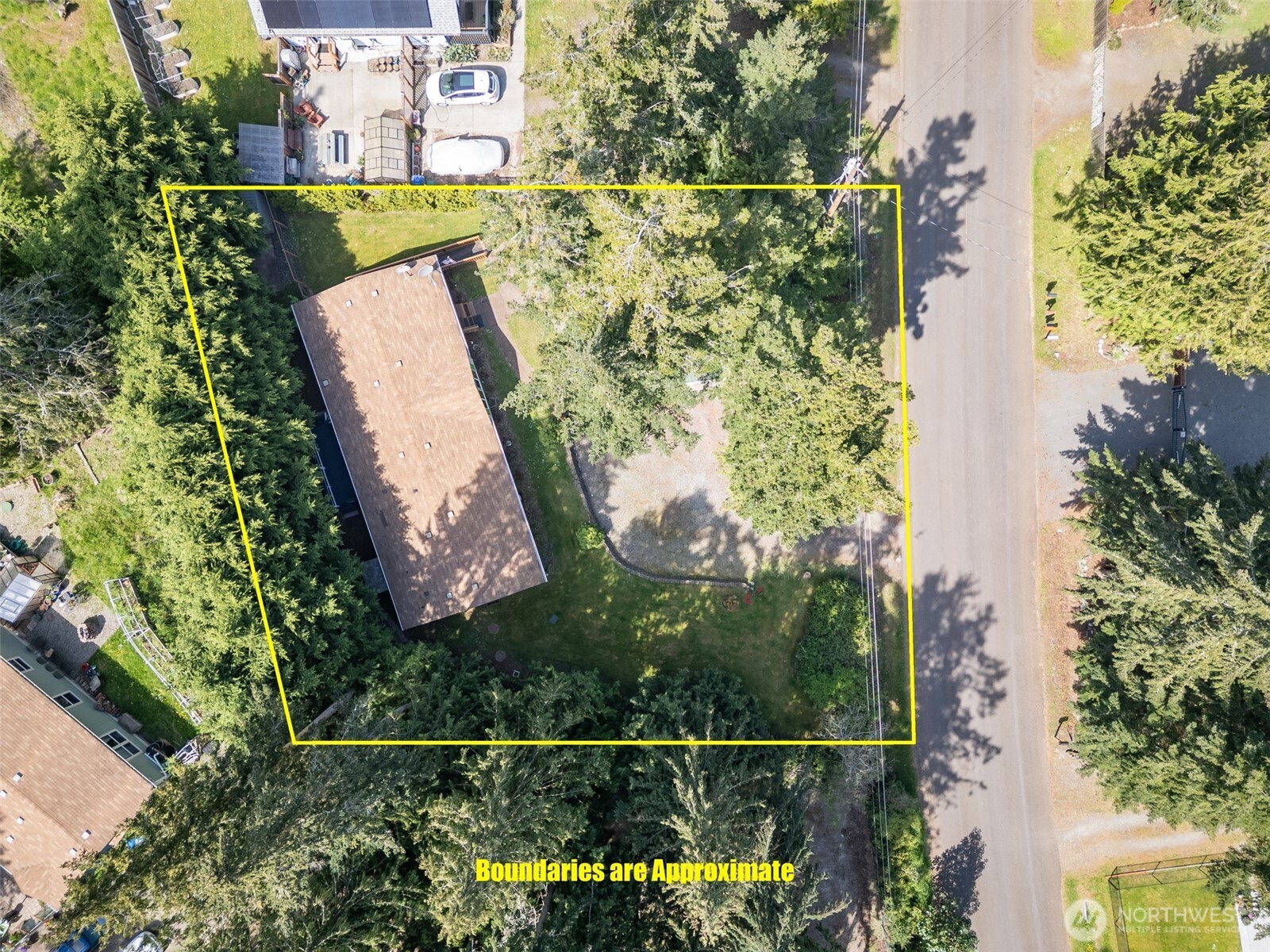 423 Fleming Drive Sequim, WA 98382 - Photo 23 of 33 an aerial view of a house with a garden
