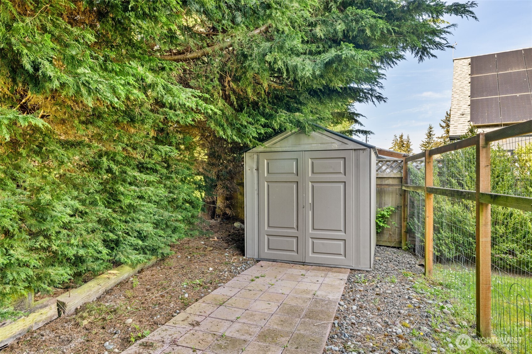 423 Fleming Drive Sequim, WA 98382 - Photo 25 of 33 a house view with a wooden door and a yard