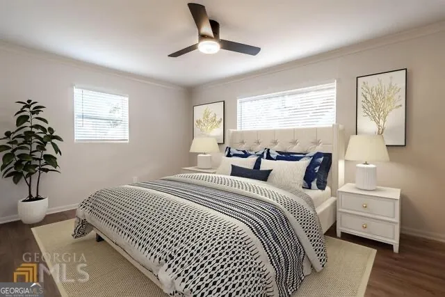 a bedroom with a large bed and a potted plant
