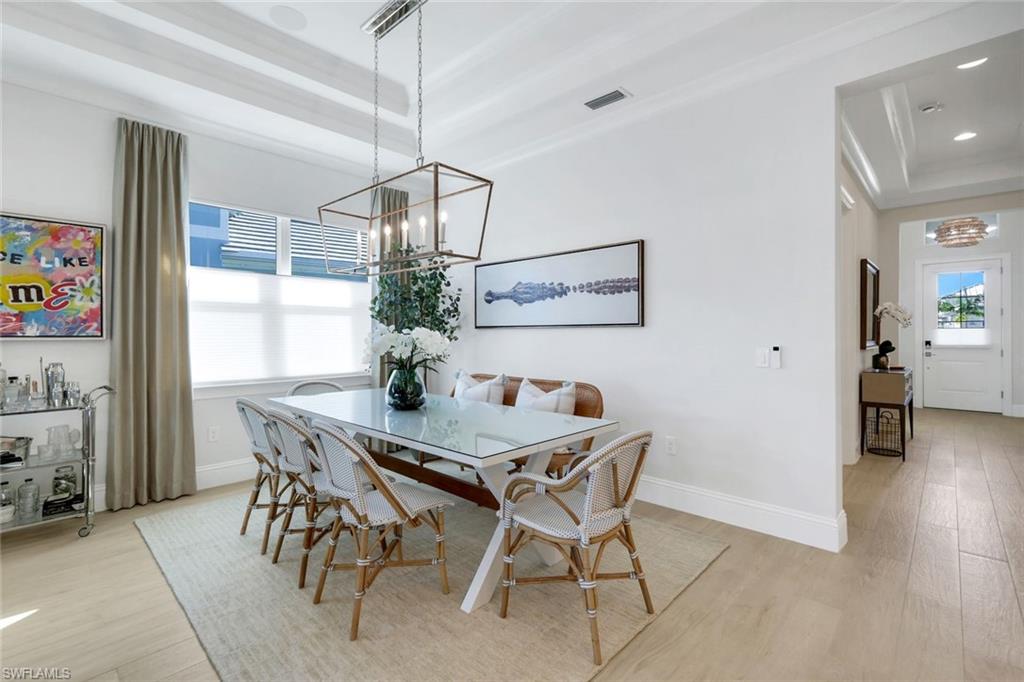 8825 Yucatan Court Naples, FL 34113 - Photo 13 of 45 a view of a dining room with furniture and window