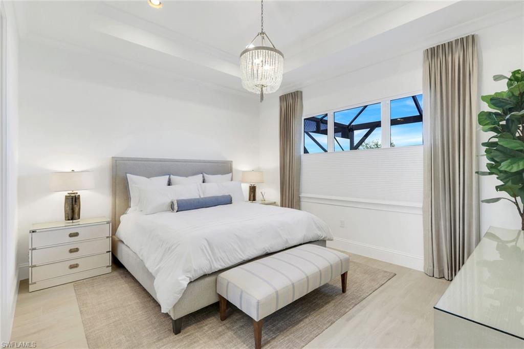 8825 Yucatan Court Naples, FL 34113 - Photo 16 of 45 a bedroom with bed and a window