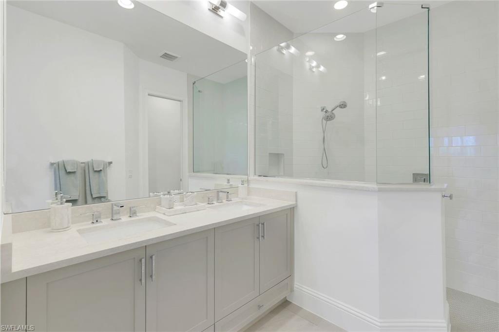 8825 Yucatan Court Naples, FL 34113 - Photo 18 of 45 a bathroom with a sink and a mirror