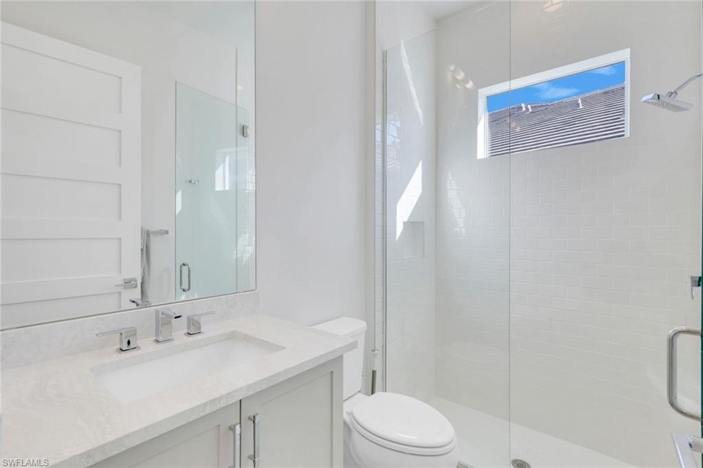 8825 Yucatan Court Naples, FL 34113 - Photo 24 of 45 a bathroom with a sink a toilet and shower