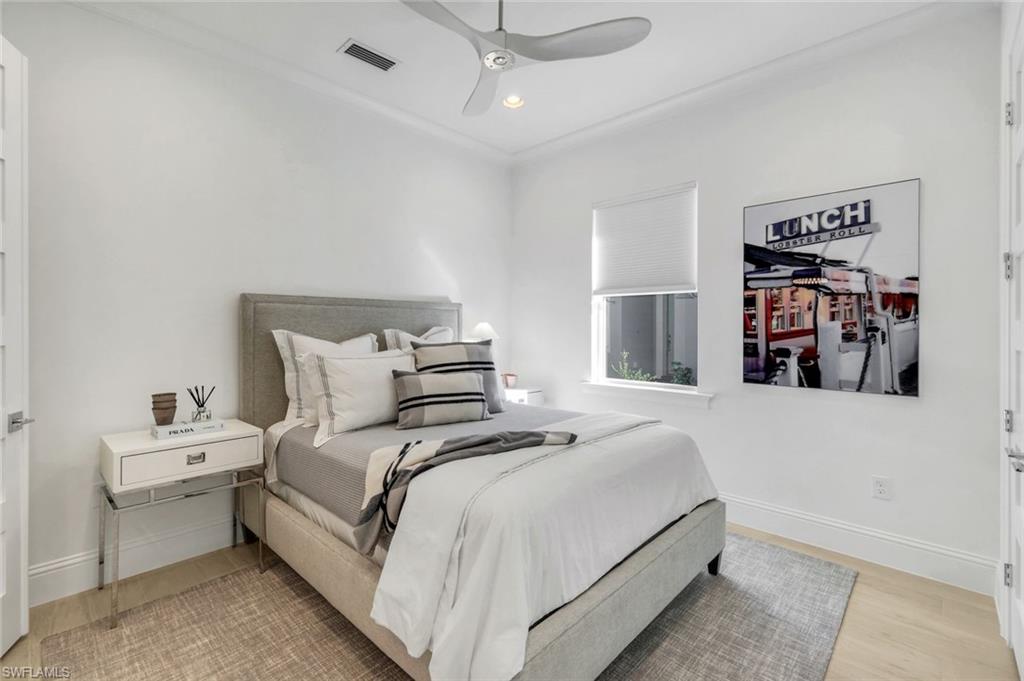 8825 Yucatan Court Naples, FL 34113 - Photo 25 of 45 a bedroom with bed and window