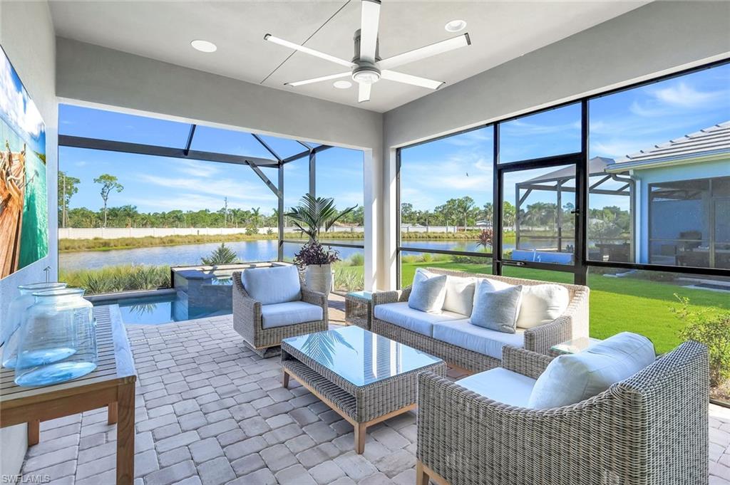 8825 Yucatan Court Naples, FL 34113 - Photo 28 of 45 a living room with furniture and a large window