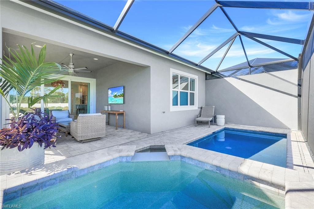 8825 Yucatan Court Naples, FL 34113 - Photo 29 of 45 a bedroom with furniture and a potted plant