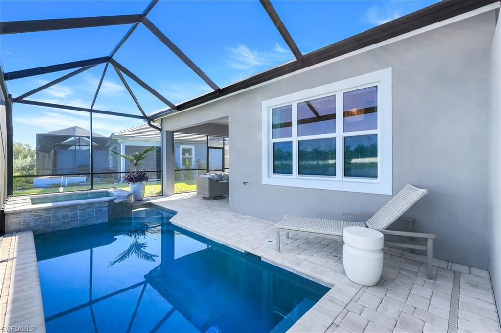 8825 Yucatan Court Naples, FL 34113 - Photo 30 of 45 a room with lots of furniture and a potted plant