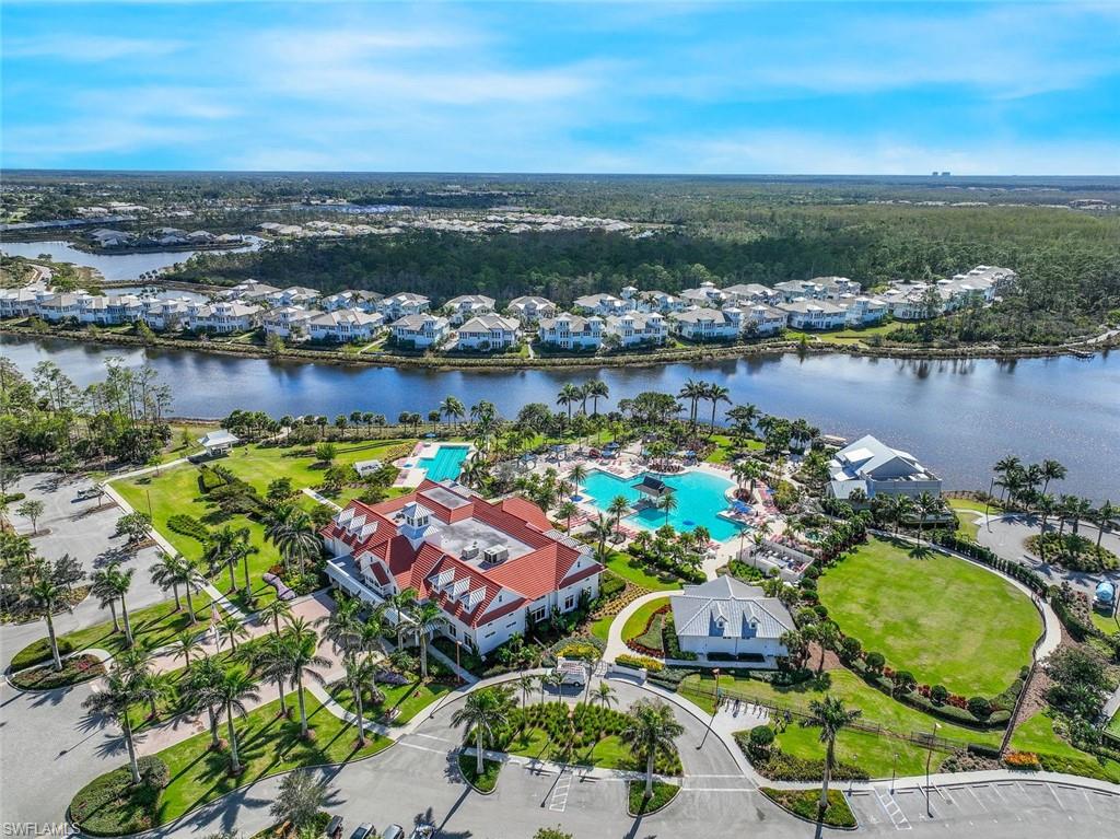 8825 Yucatan Court Naples, FL 34113 - Photo 38 of 45 an aerial view of lake residential houses with outdoor space and ocean view