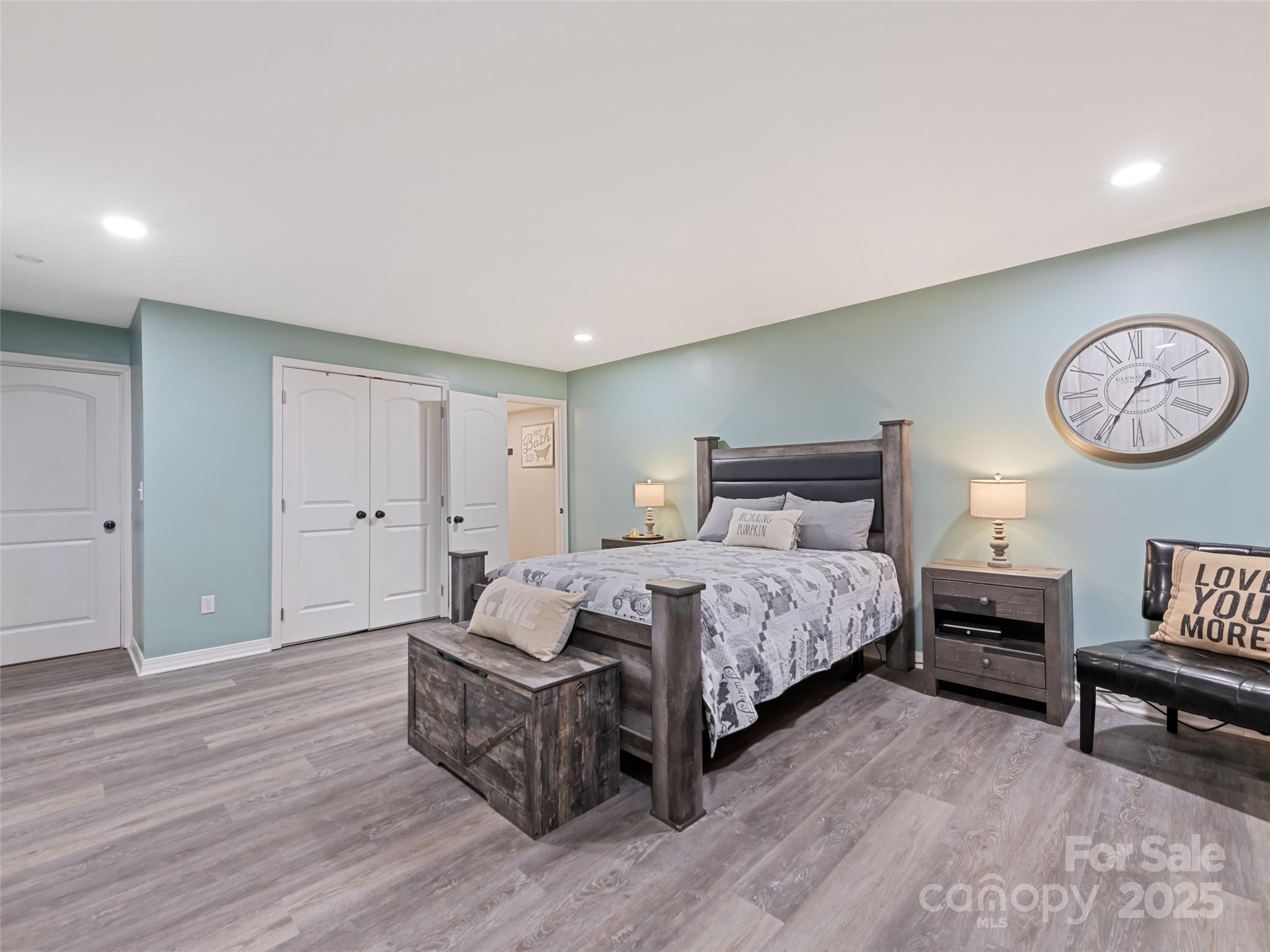 148 Mingus Cove Road Canton, NC 28716 - Photo 23 of 34 a bedroom with furniture and a large window