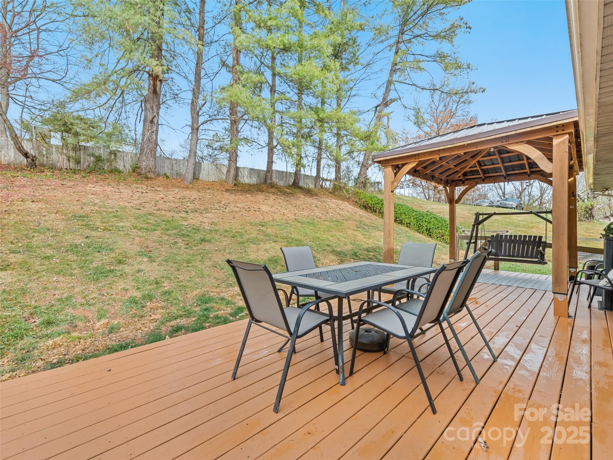 148 Mingus Cove Road Canton, NC 28716 - Photo 5 of 34 a patio with wooden floor and city view