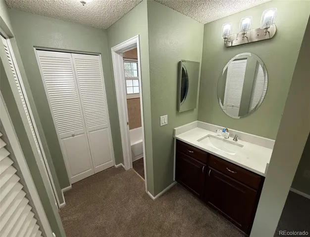 a bathroom with a double vanity sink and mirror