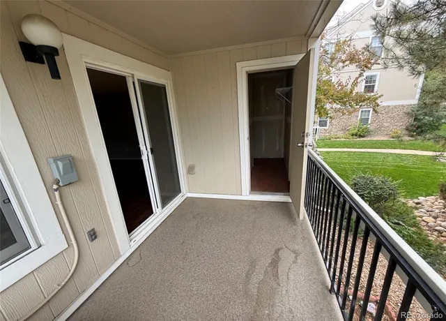 a view of balcony with yard