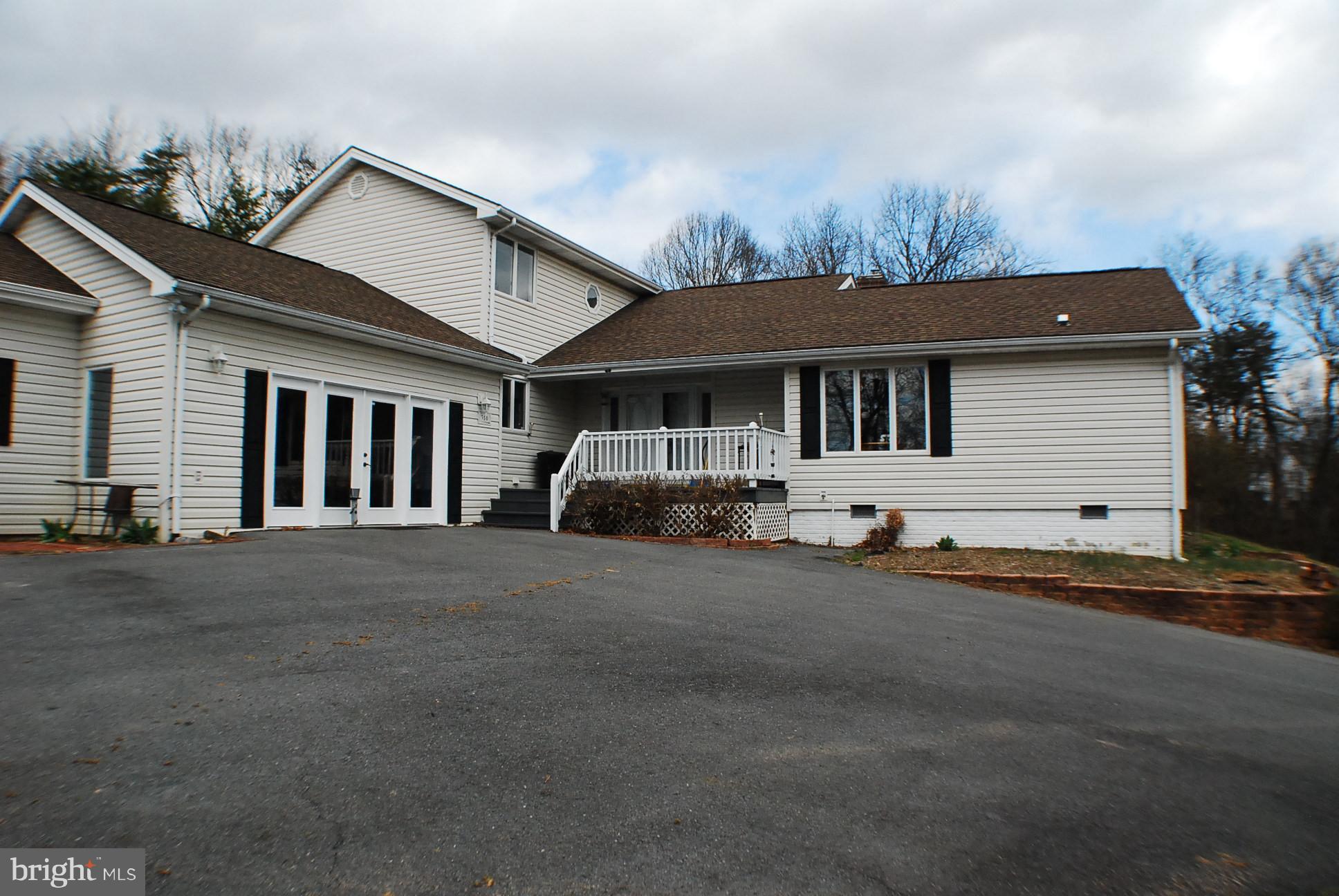 350 Redland Road Cross Junction, VA 22625 - Photo 1 of 30 a front view of a house with a yard