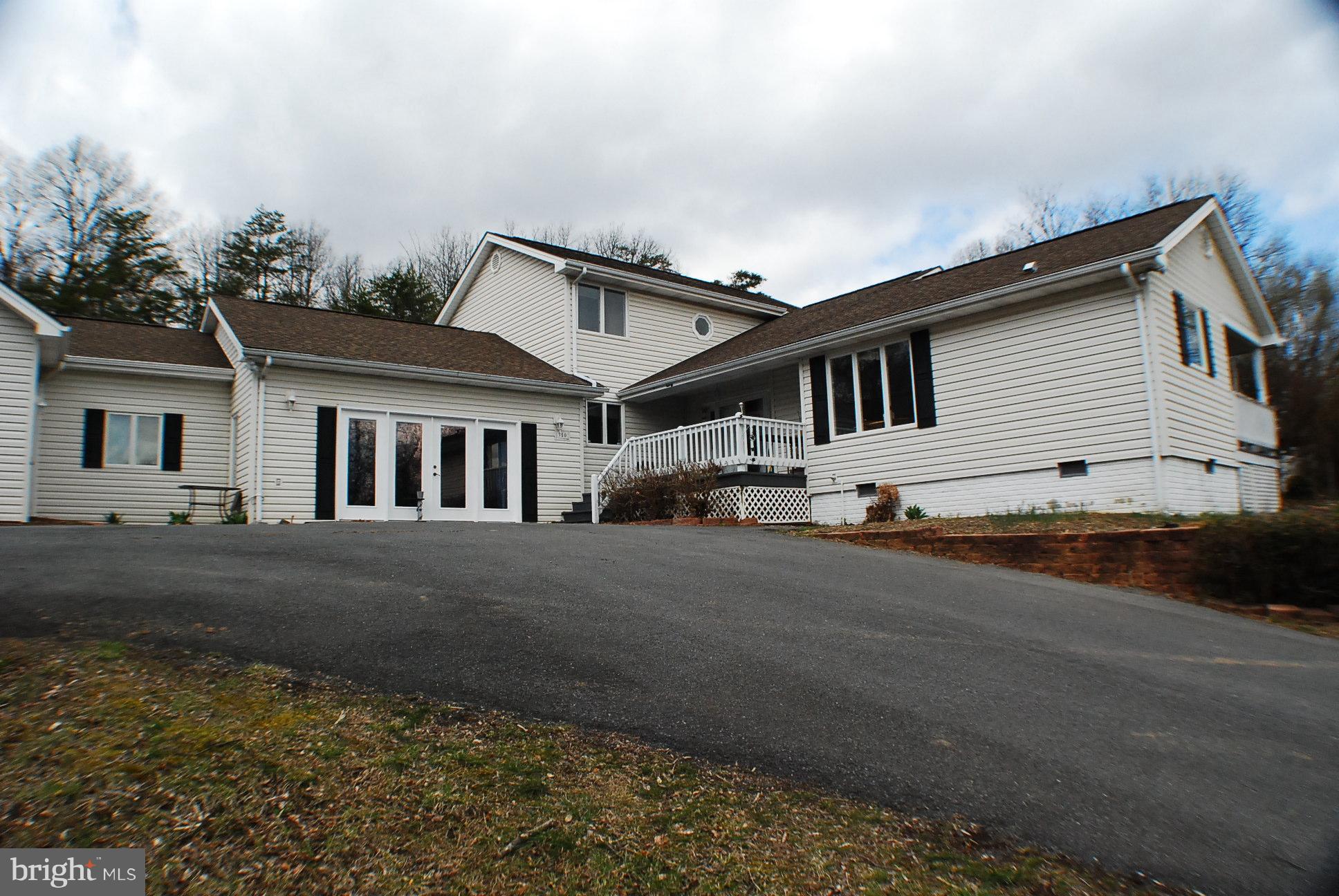 350 Redland Road Cross Junction, VA 22625 - Photo 18 of 30 a front view of a house with a yard and garage