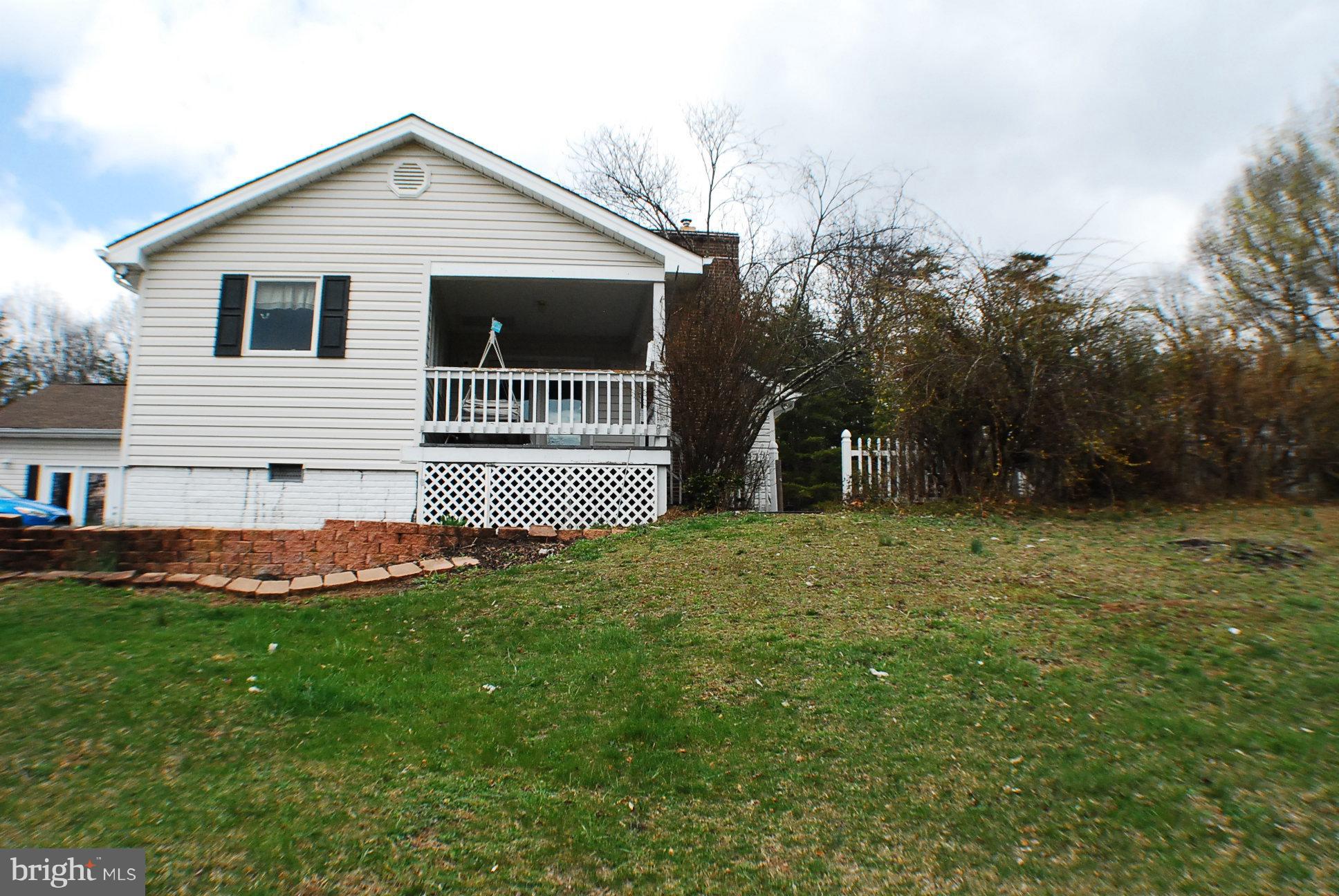 350 Redland Road Cross Junction, VA 22625 - Photo 30 of 30 a front view of a house with a yard and garage