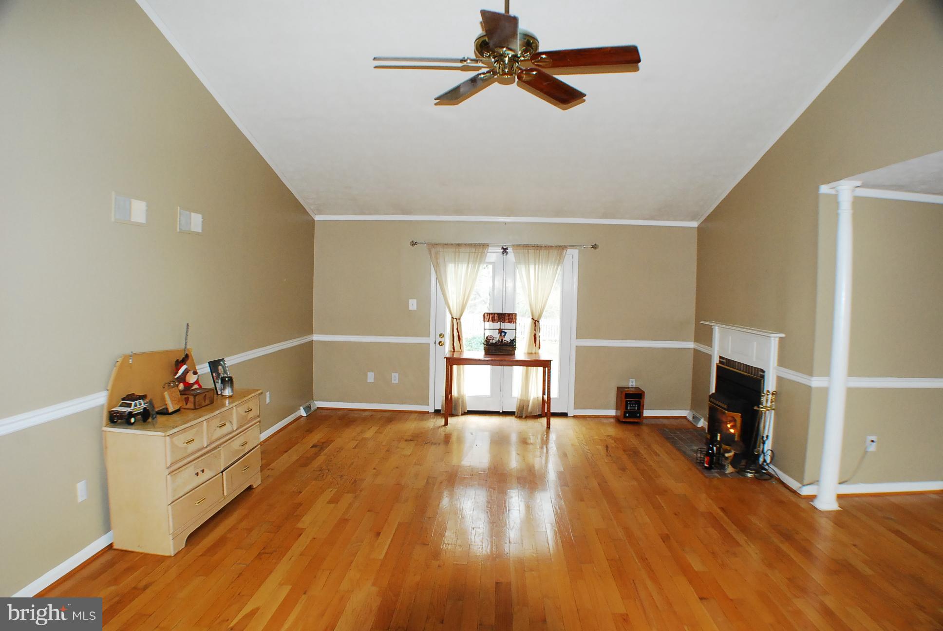 350 Redland Road Cross Junction, VA 22625 - Photo 4 of 30 a view of empty room with wooden floor and fan