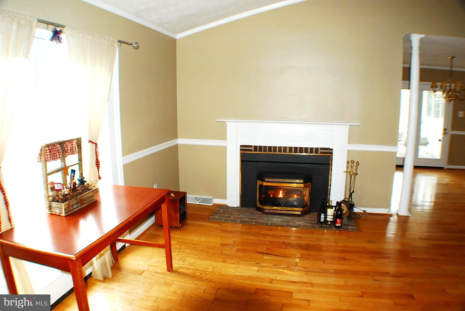 350 Redland Road Cross Junction, VA 22625 - Photo 5 of 30 a living room with furniture and a fireplace