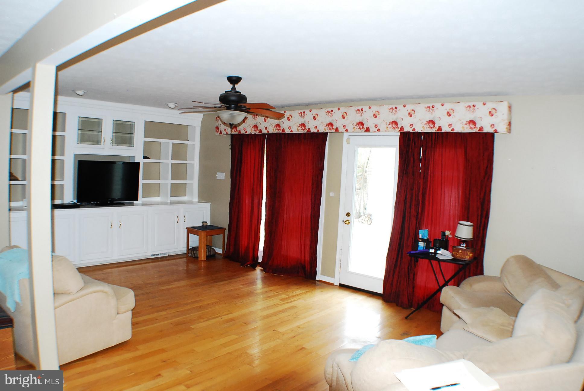 350 Redland Road Cross Junction, VA 22625 - Photo 8 of 30 a living room with furniture and a flat screen tv