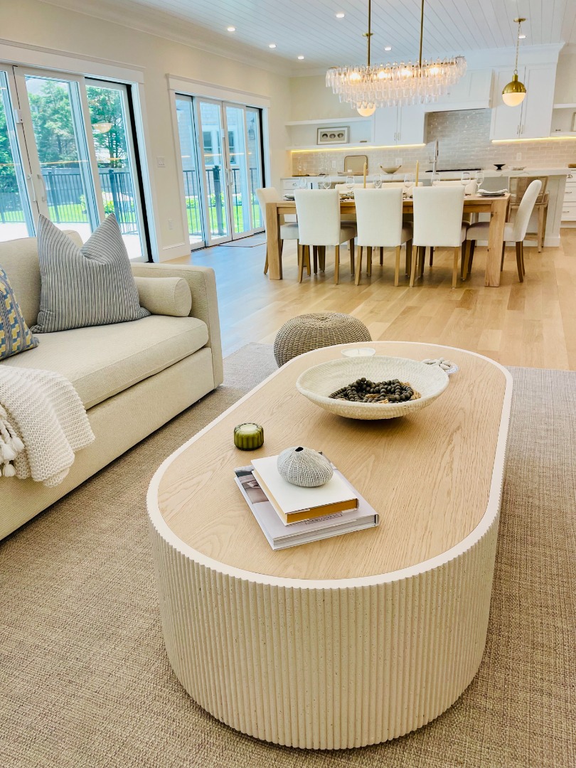 23 Pinehurst Road Edgartown, MA 02539 - Photo 12 of 57 a living room with furniture and a table