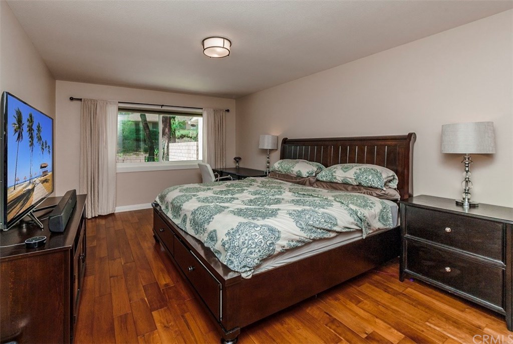 8 Hawthorn Irvine, CA 92612 - Photo 12 of 27 a bedroom with a bed and a night stand