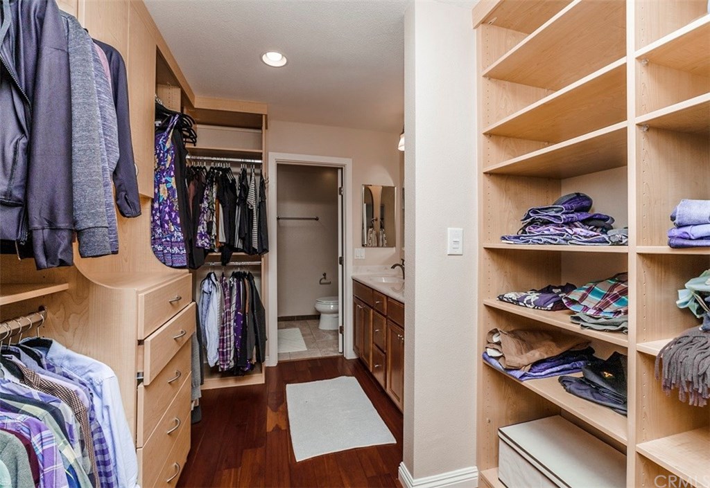 8 Hawthorn Irvine, CA 92612 - Photo 14 of 27 a view of walk in closet with clothes and shoes