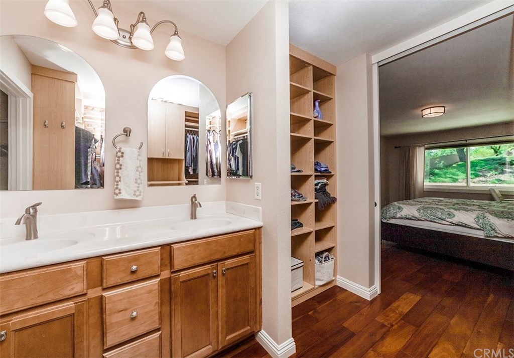 8 Hawthorn Irvine, CA 92612 - Photo 15 of 27 a en suite bathroom with a double vanity sink and a mirror