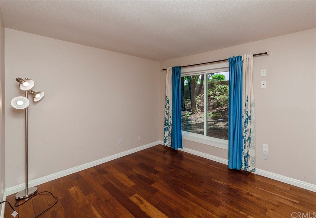 8 Hawthorn Irvine, CA 92612 - Photo 19 of 27 an empty room with wooden floor and windows