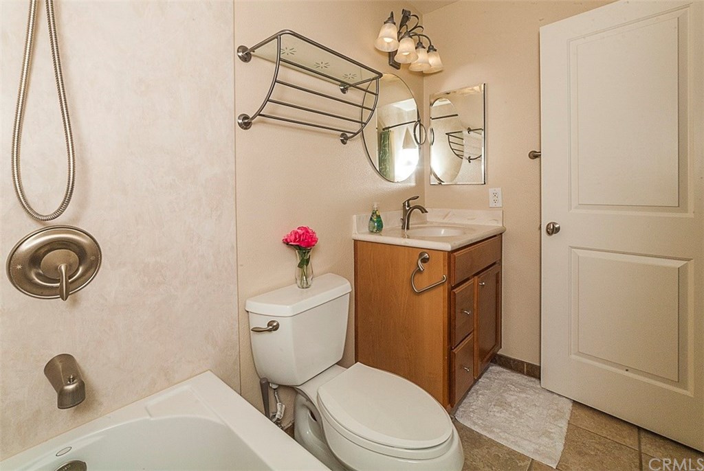 8 Hawthorn Irvine, CA 92612 - Photo 21 of 27 a bathroom with a toilet sink vanity granite and shower