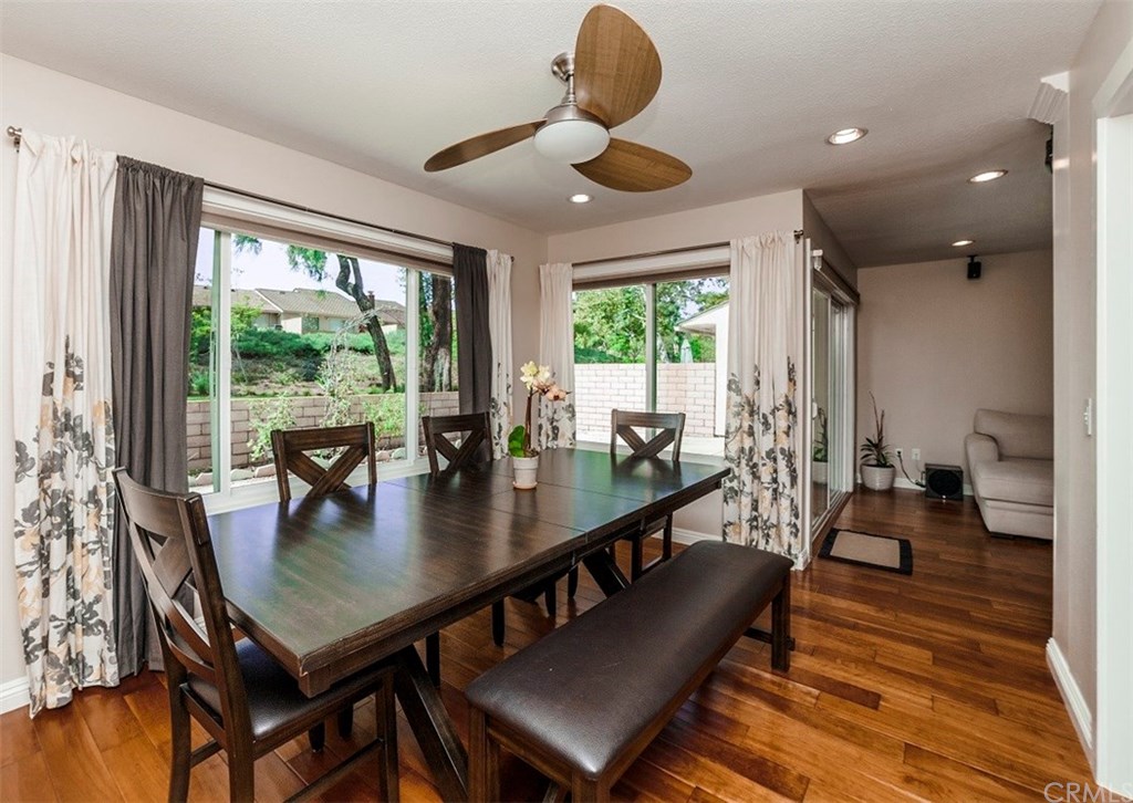 8 Hawthorn Irvine, CA 92612 - Photo 8 of 27 a dining room with furniture and wooden floor