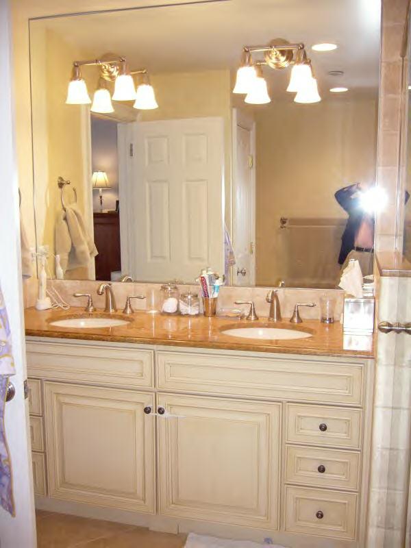 Undisclosed Address New Canaan, CT 06840 - Photo 2 of 14 a bathroom with a sink vanity and a mirror