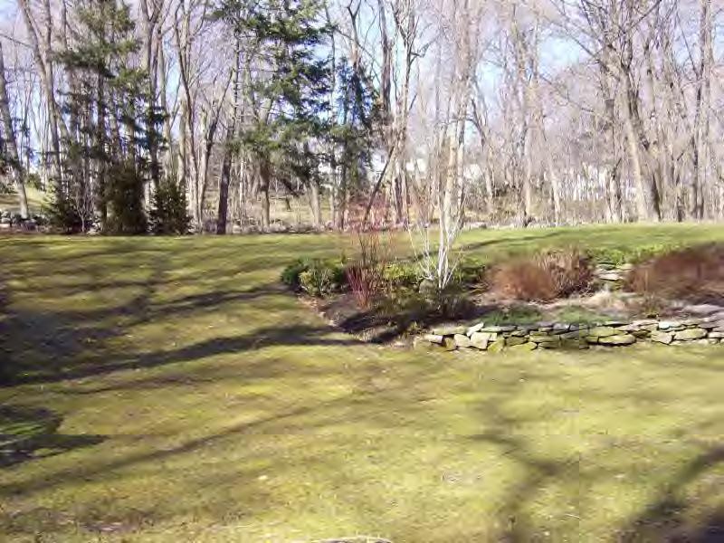 Undisclosed Address New Canaan, CT 06840 - Photo 6 of 14 a view of a yard with swimming pool