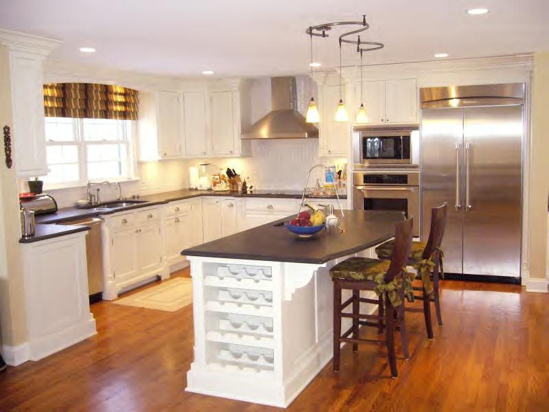 Undisclosed Address New Canaan, CT 06840 - Photo 7 of 14 a kitchen with stainless steel appliances a dining table chairs stove refrigerator and microwave