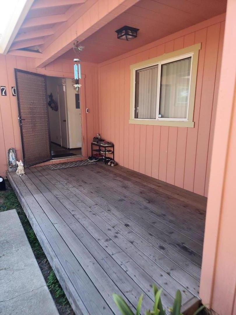 70 Overpass Road Watsonville, CA 95076 - Photo 1 of 29 a view of an empty room with wooden floor and a window