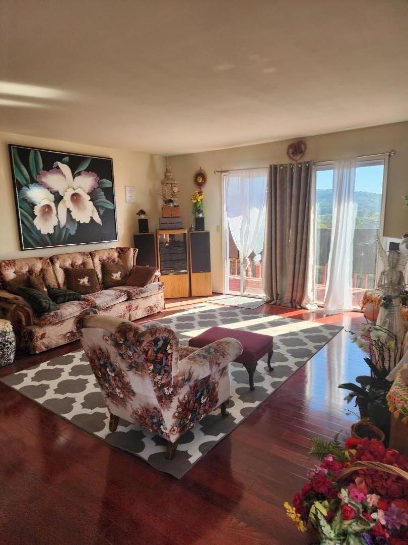 70 Overpass Road Watsonville, CA 95076 - Photo 12 of 29 a living room with large couches and painting on the wall