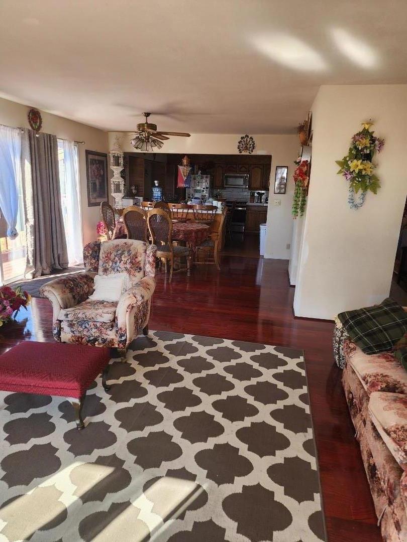 70 Overpass Road Watsonville, CA 95076 - Photo 13 of 29 a living room with furniture and a rug