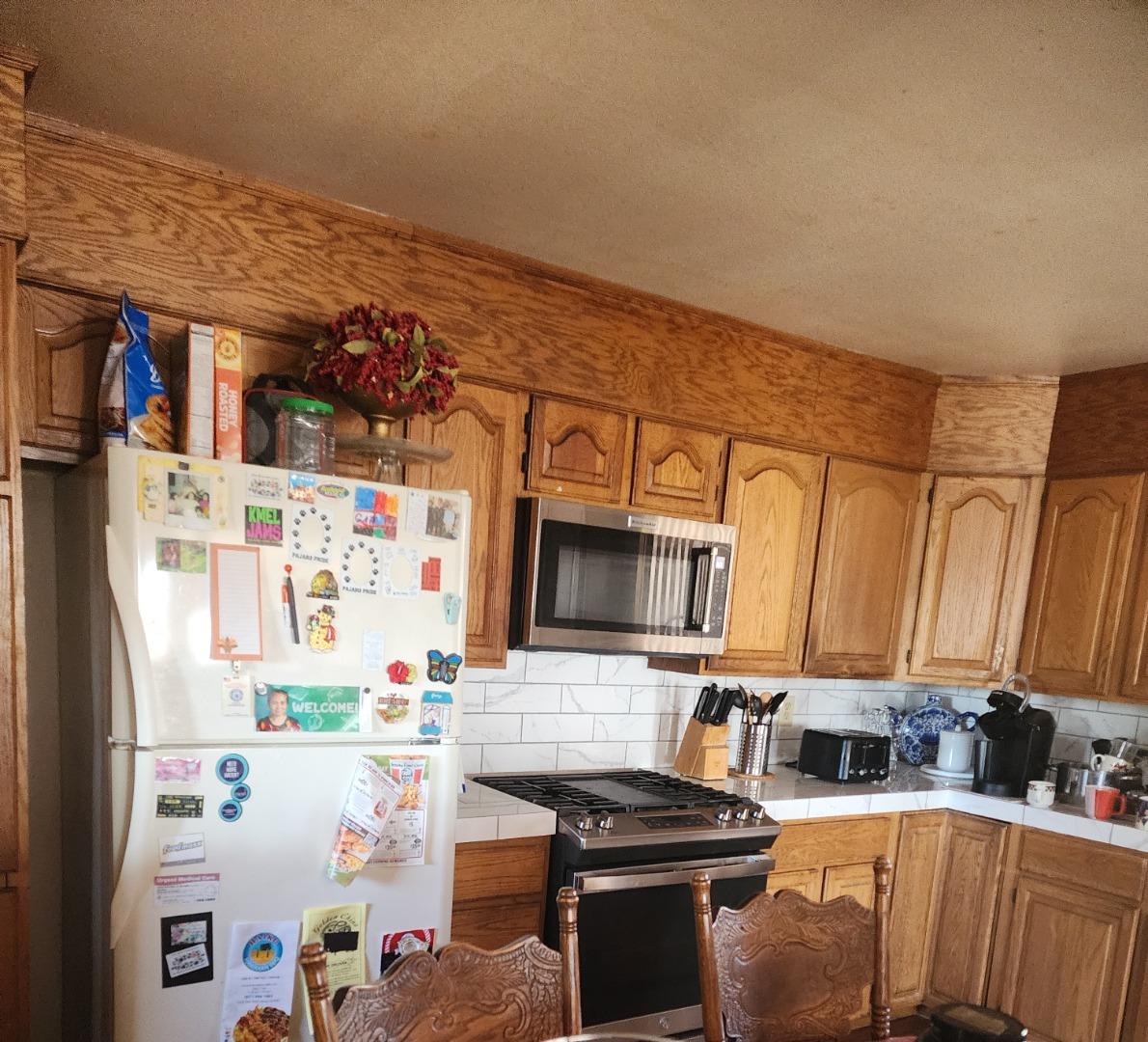 70 Overpass Road Watsonville, CA 95076 - Photo 15 of 29 a kitchen with stainless steel appliances a stove a microwave and a refrigerator