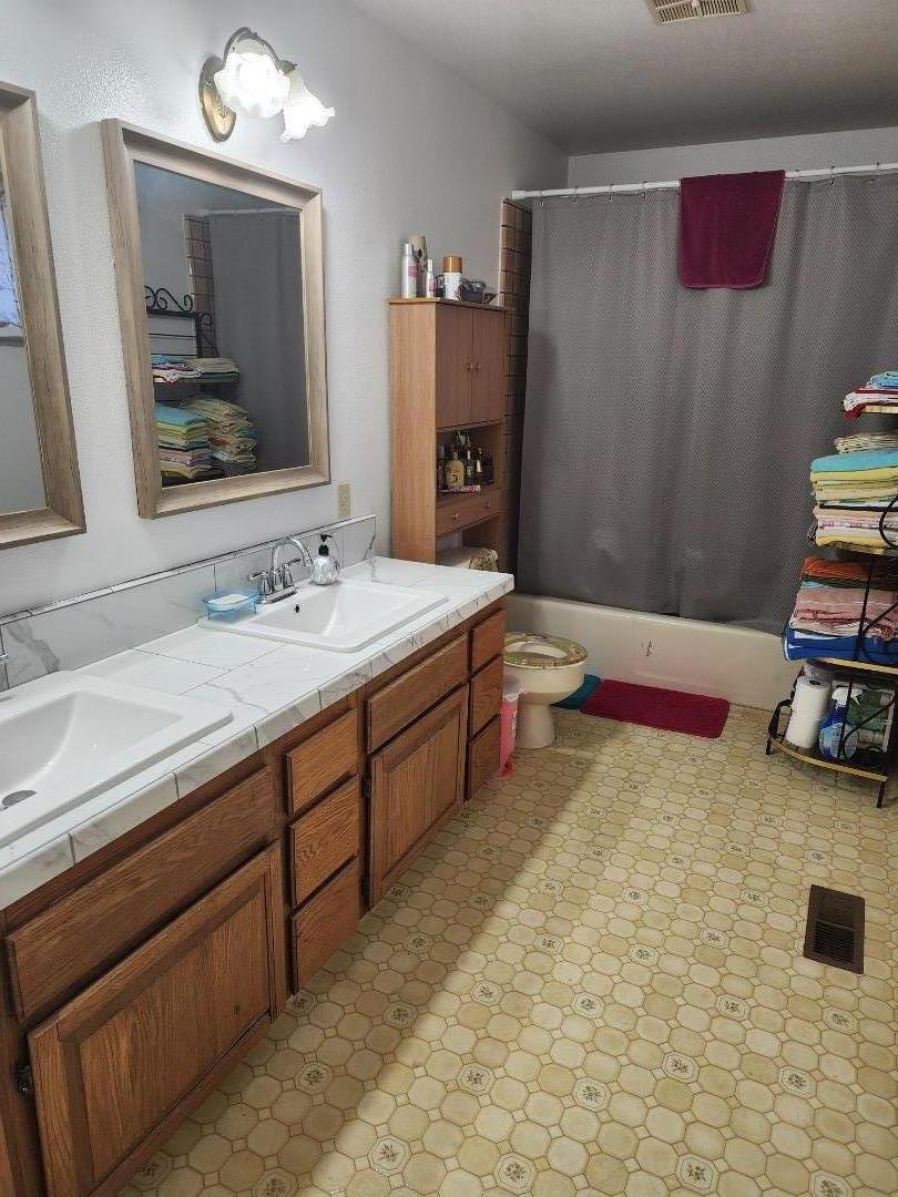 70 Overpass Road Watsonville, CA 95076 - Photo 22 of 29 a spacious bathroom with a double vanity sink and a mirror