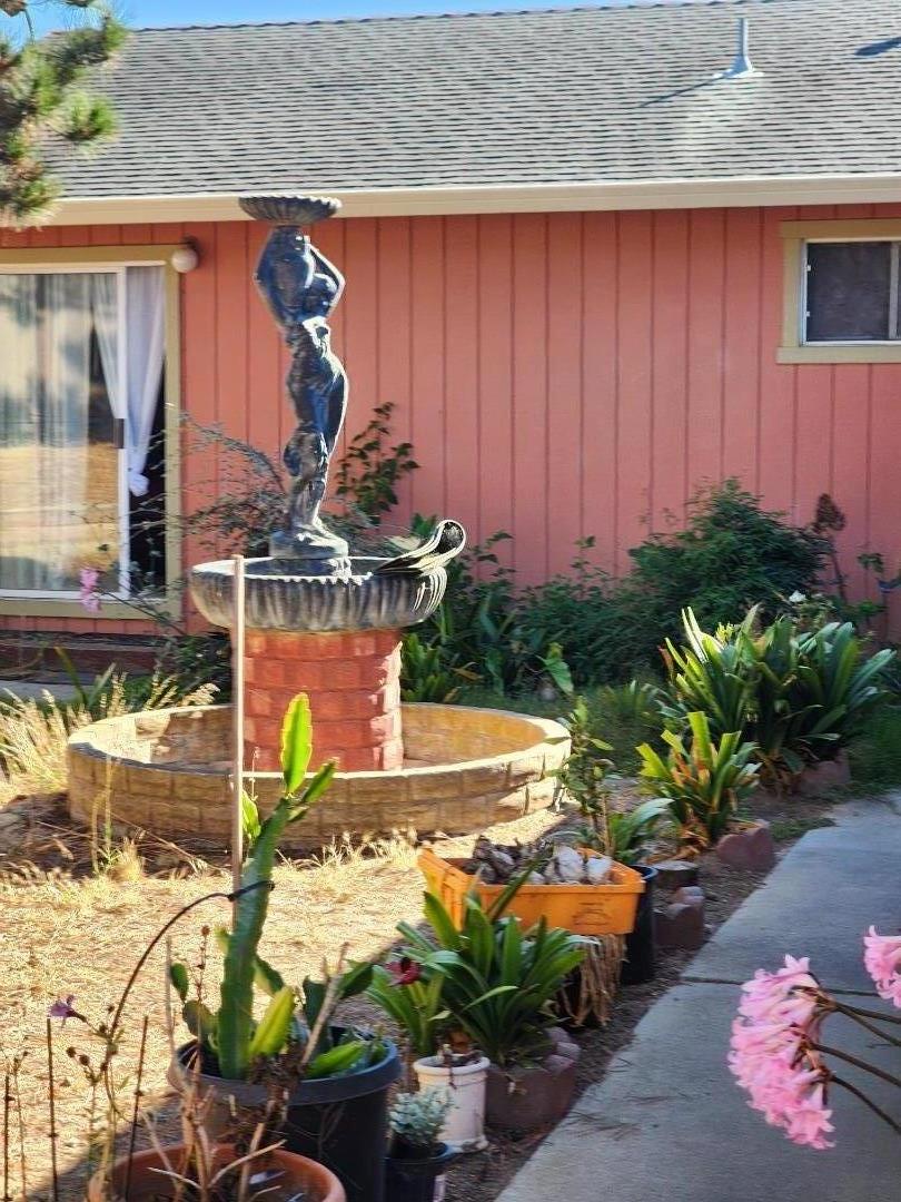 70 Overpass Road Watsonville, CA 95076 - Photo 27 of 29 a front view of a house with a yard and outdoor seating