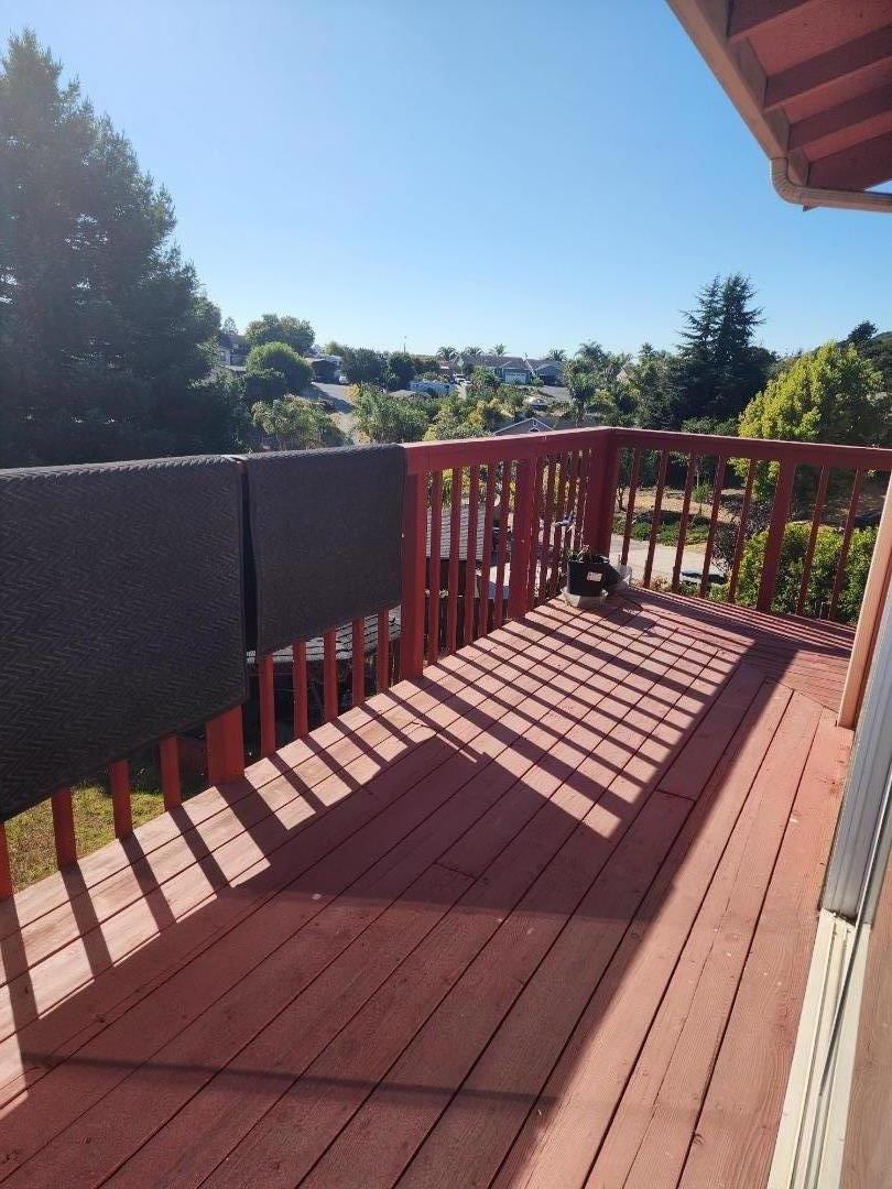 70 Overpass Road Watsonville, CA 95076 - Photo 3 of 29 a view of a roof deck with wooden floor and fence